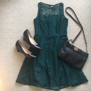 Green lace dress with open back detail