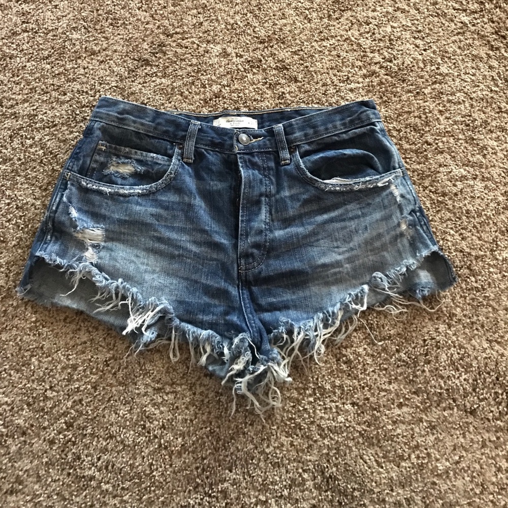 High-waisted distressed denim shorts