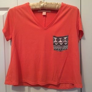 Rebellious. One. orange crop top