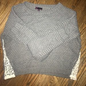 Soft and light sweater with adorable lace sides.
