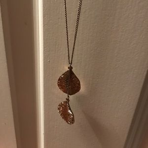 Gold long necklace with two leafs