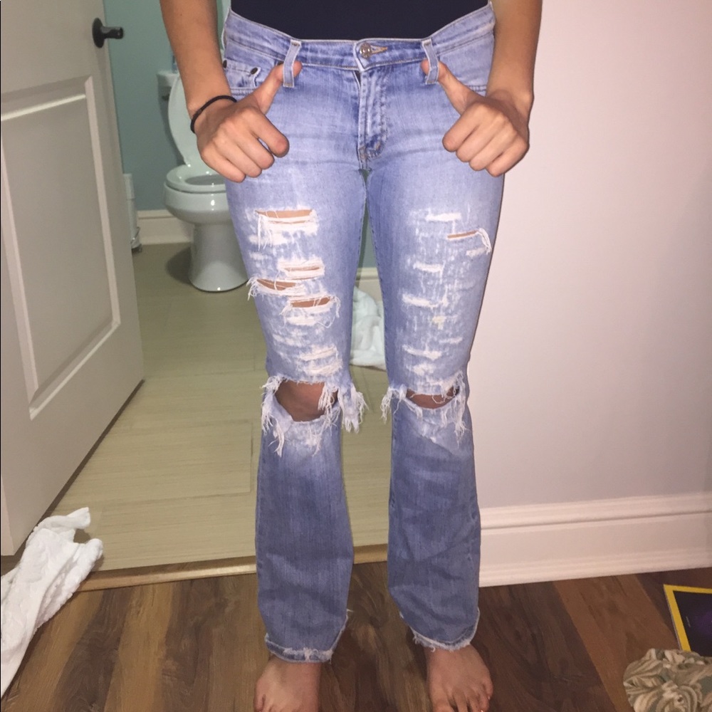 Low rise bell bottom distressed ripped jeans