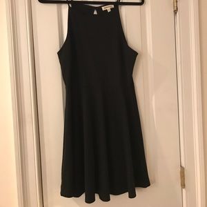 Medium black dress with scalloped neckline