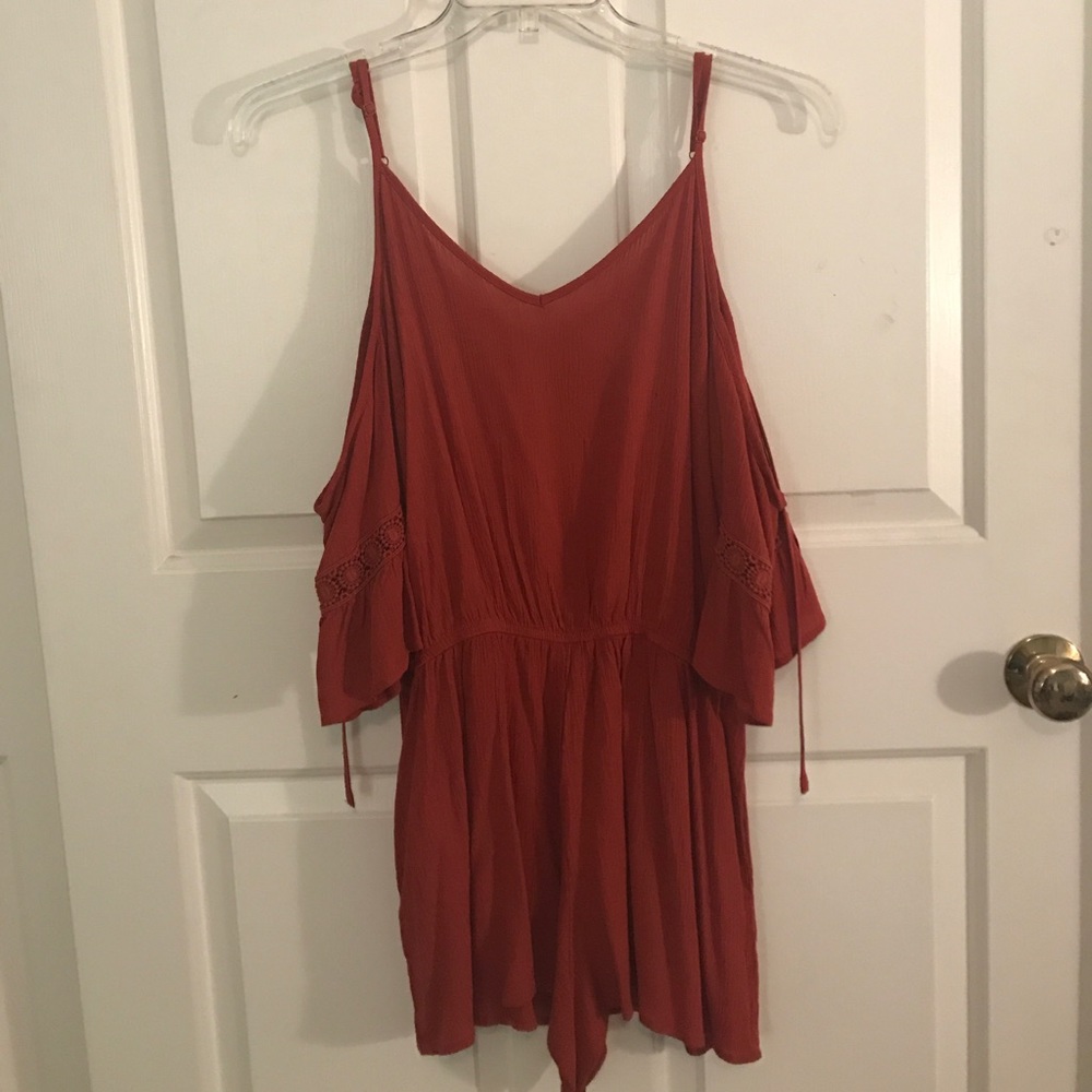 burnt orange romper with a cold shoulder