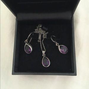 Sterling silver necklace and earring set.