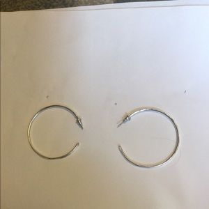 Large silver hoop earrings.   Light great size.