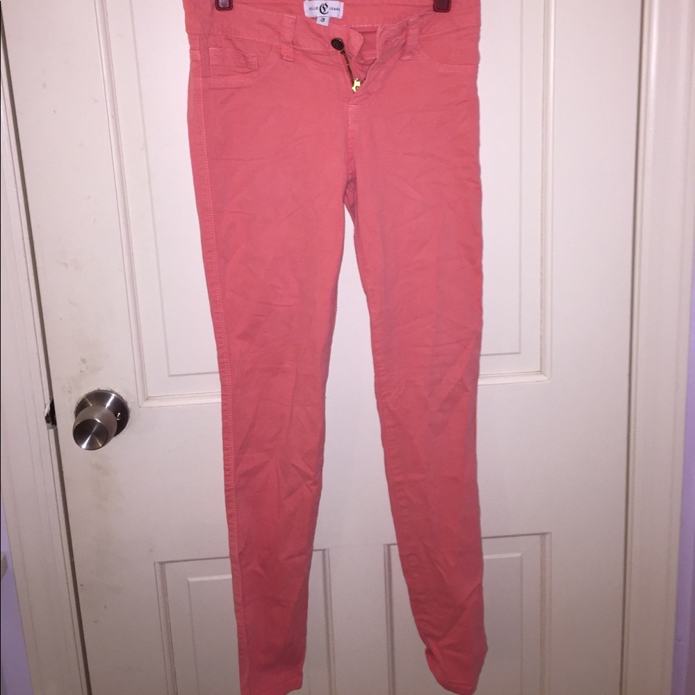 Salmon colored jeans