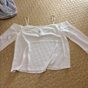 Cold shoulder 3/4 sleeve blouse slightly sheer.