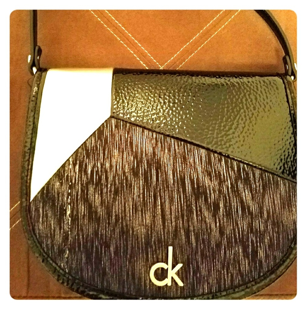 ***Sold***CK flap over purse 7"long x 8"wide