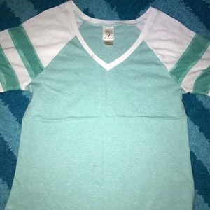 Turquoise tee with mesh stripes on the sleeves