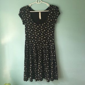 black dress with floral designs.