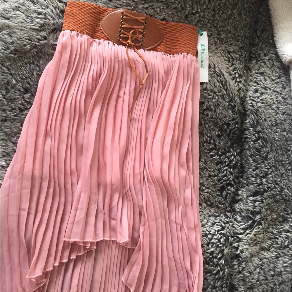 MUST HAVE. ♥️ hi low pleated corset skirt