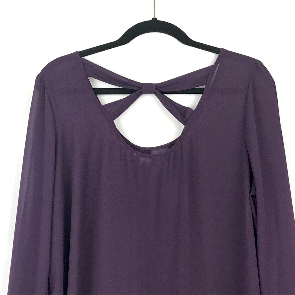 Sheer purple blouse with bow style back