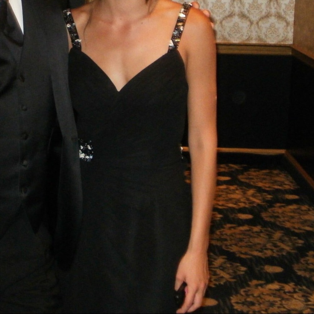 Open back /slit up the leg. sweetheart neckline.