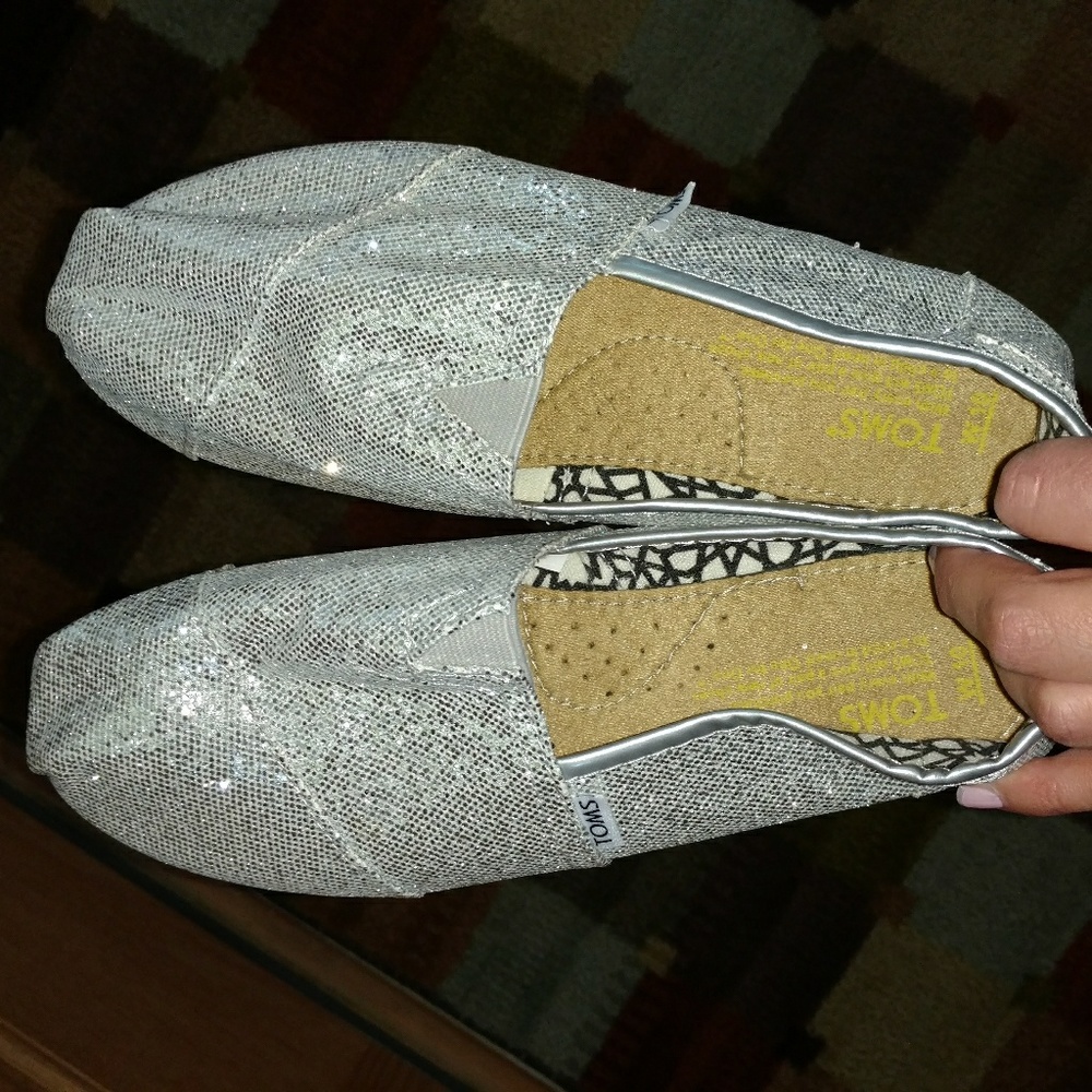 TOMS silver sparkling slip-ons