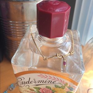 Gold pink gem bracelet.