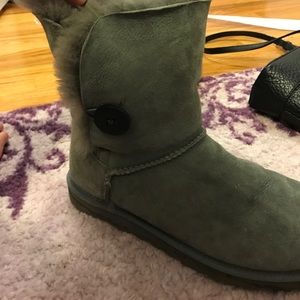 Grey UGG boots with one button
