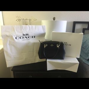 New, authentic Coach cross body purse.