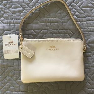 New, authentic Coach wristlet.