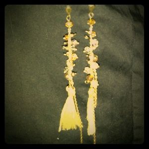 Gold beads, chains, and tassle earrings.