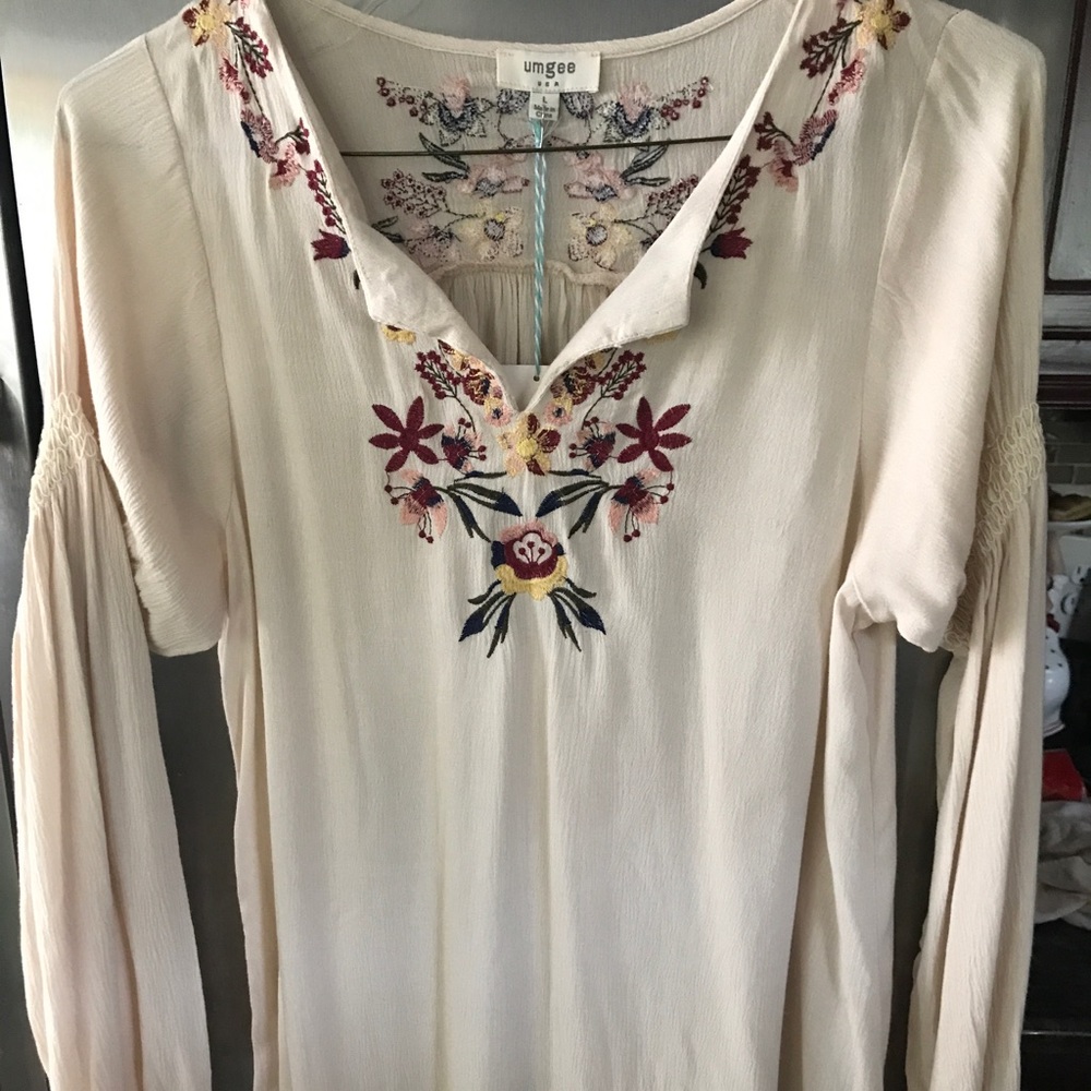 Embroidered cream dress