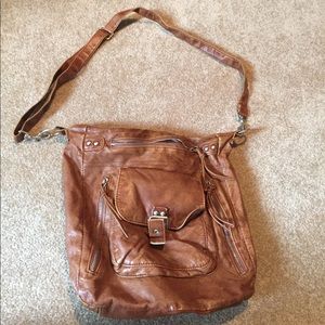 Tan satchel with adjustable strap