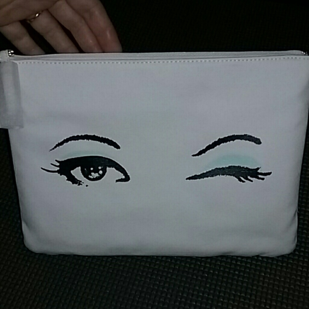 Kate spade cosmetic bag with winking eye