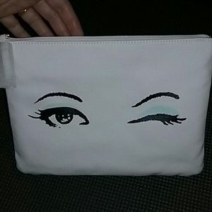 Kate spade cosmetic bag with winking eye