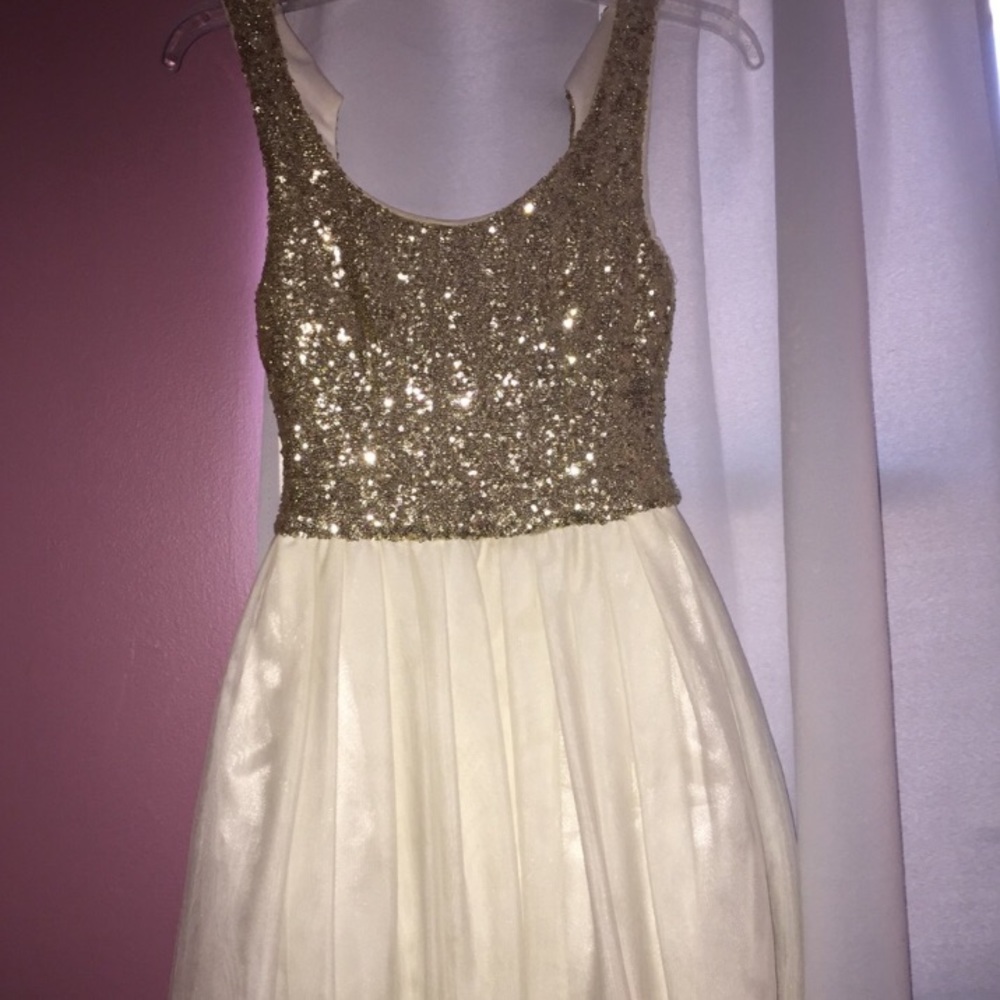 gold and white sequenced cocktail dress