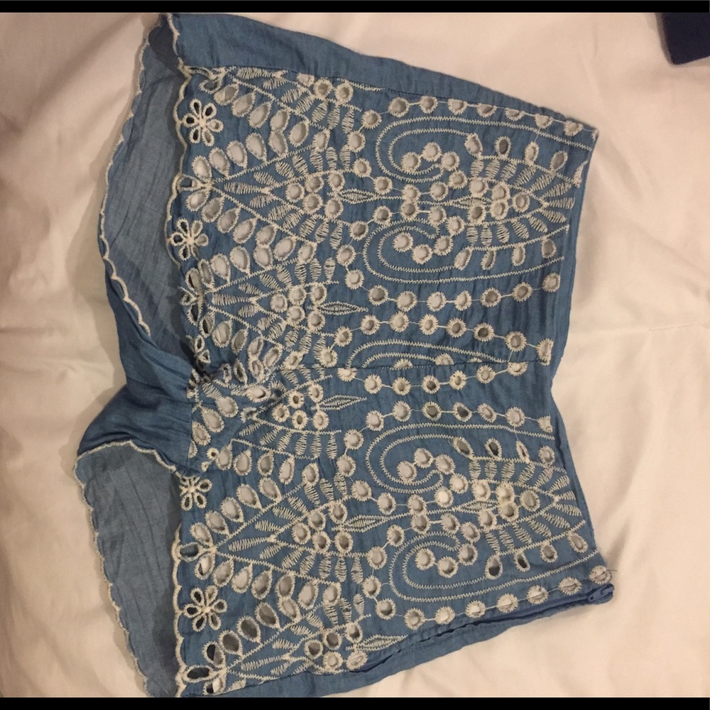 Blue shorts with cream lace on the front side