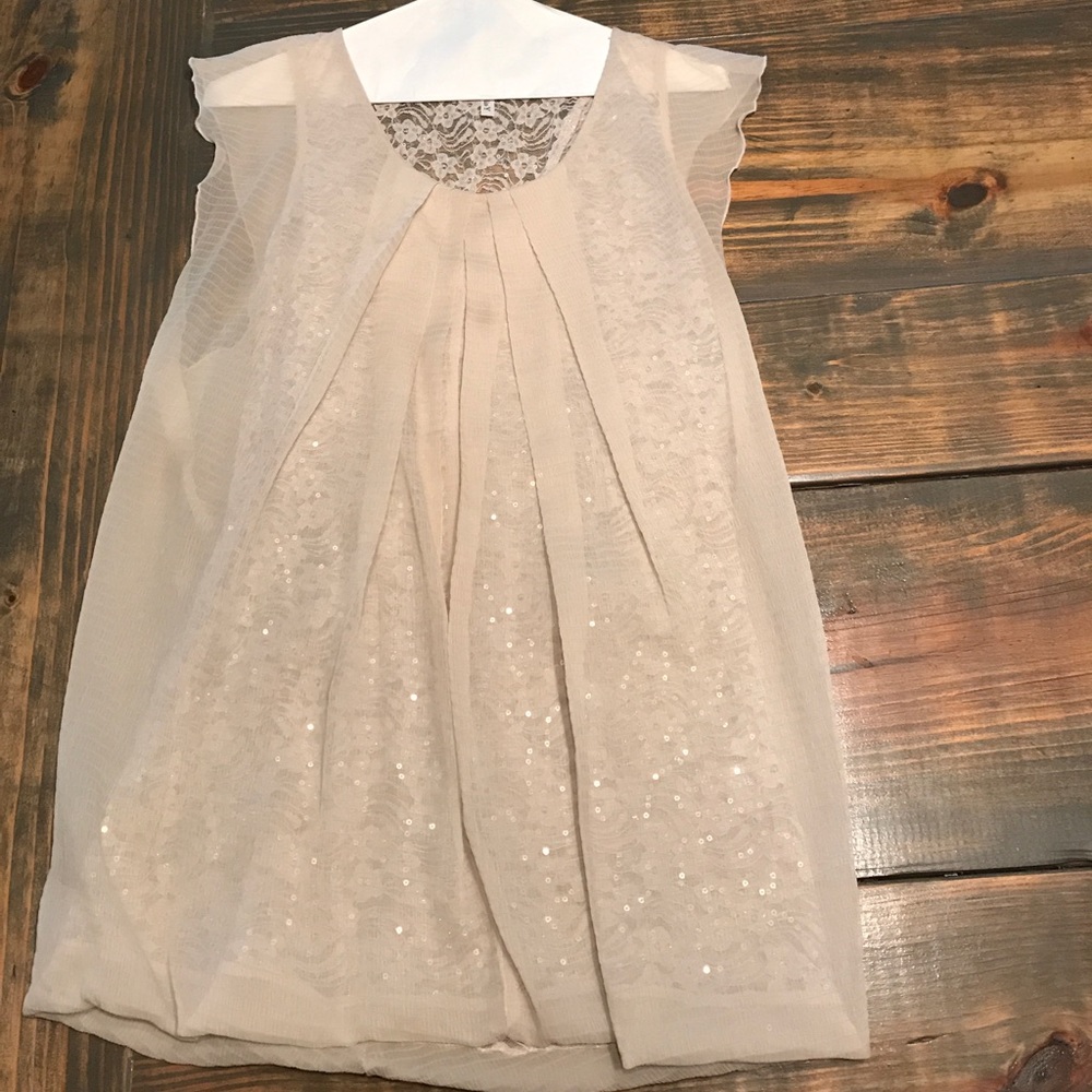 Super cute sheer, sequined top.