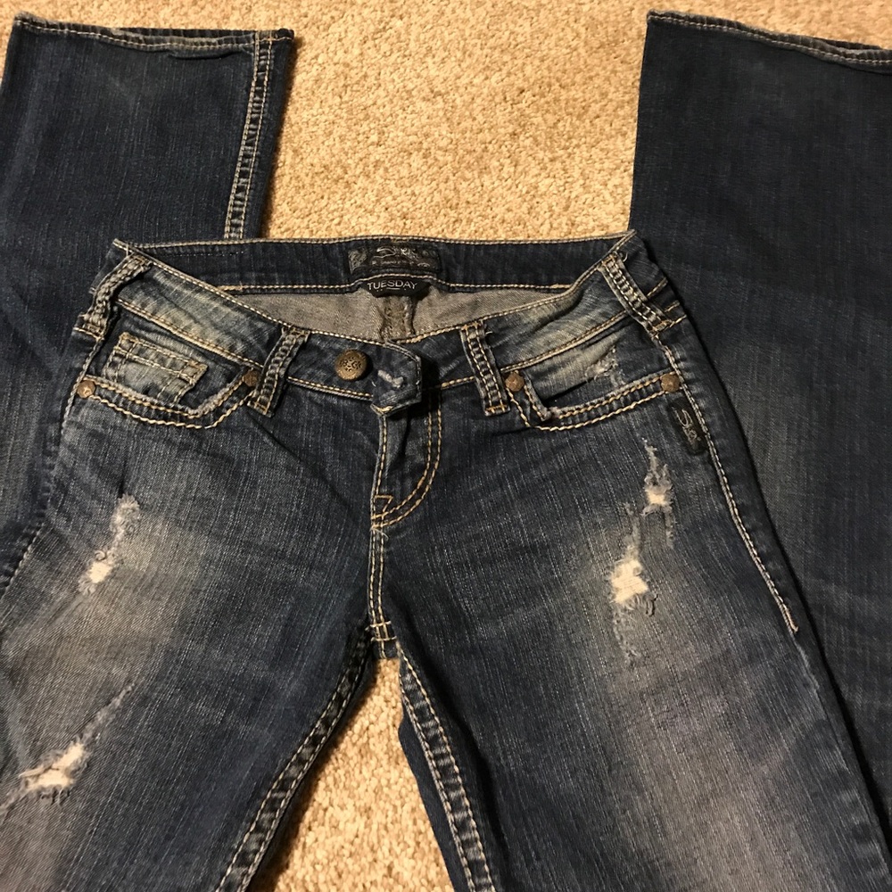 Distressed silver boot cut jeans