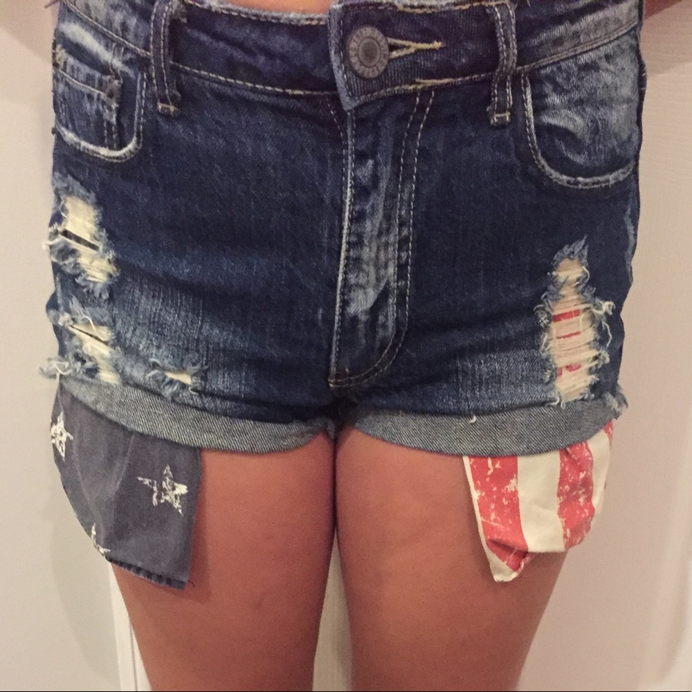 Blue distressed shorts, American flag pockets