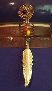 Beautiful dreadlock jewelry w/ feather accent
