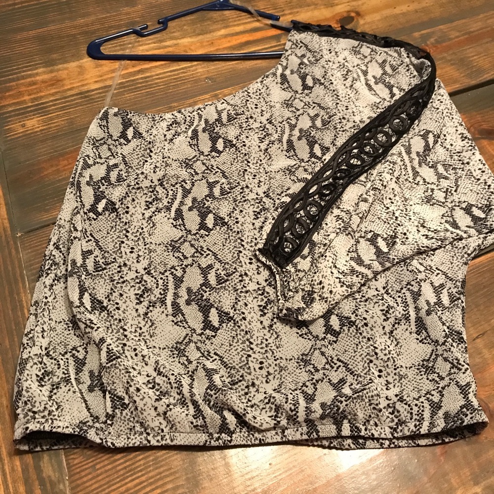 One shouldered, snake print top.