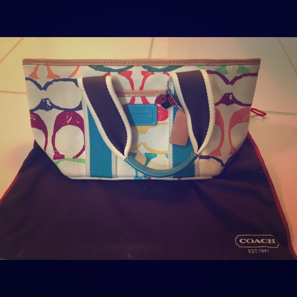 Authentic multi-colored logo Coach purse.