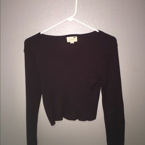 cropped maroon long sleeve shirt.