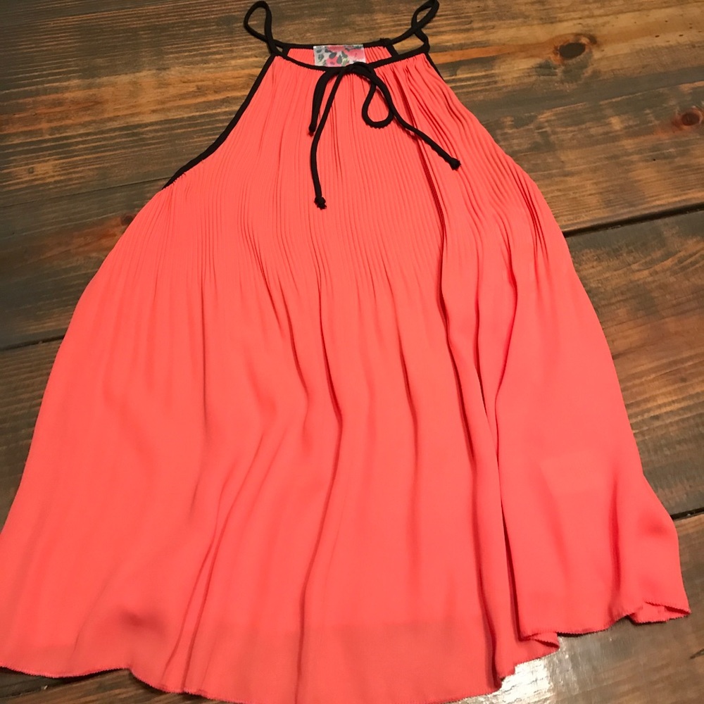 Coral top with black lining.