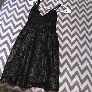 Black and gold lace dress