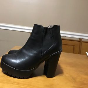 Black platform ankle boots.
