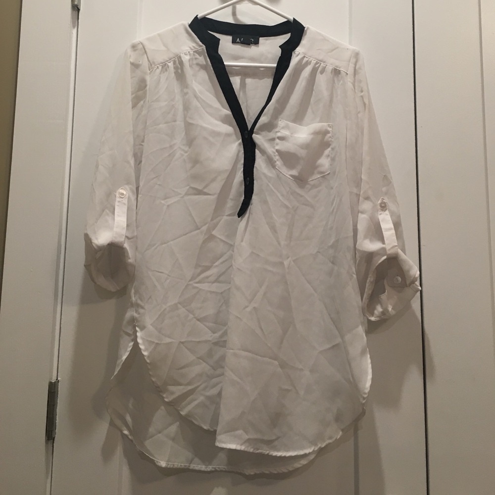 Sheer white blouse with black detail