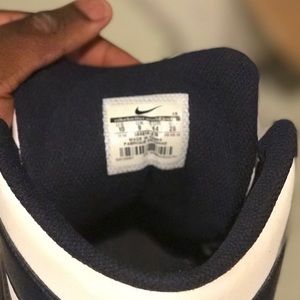 Navy blue and white nikes