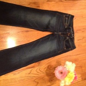 Dark wash Jeans in long fit slim boot cut