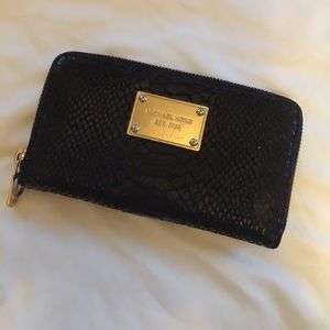 Michael Kors snake print leather wallet.