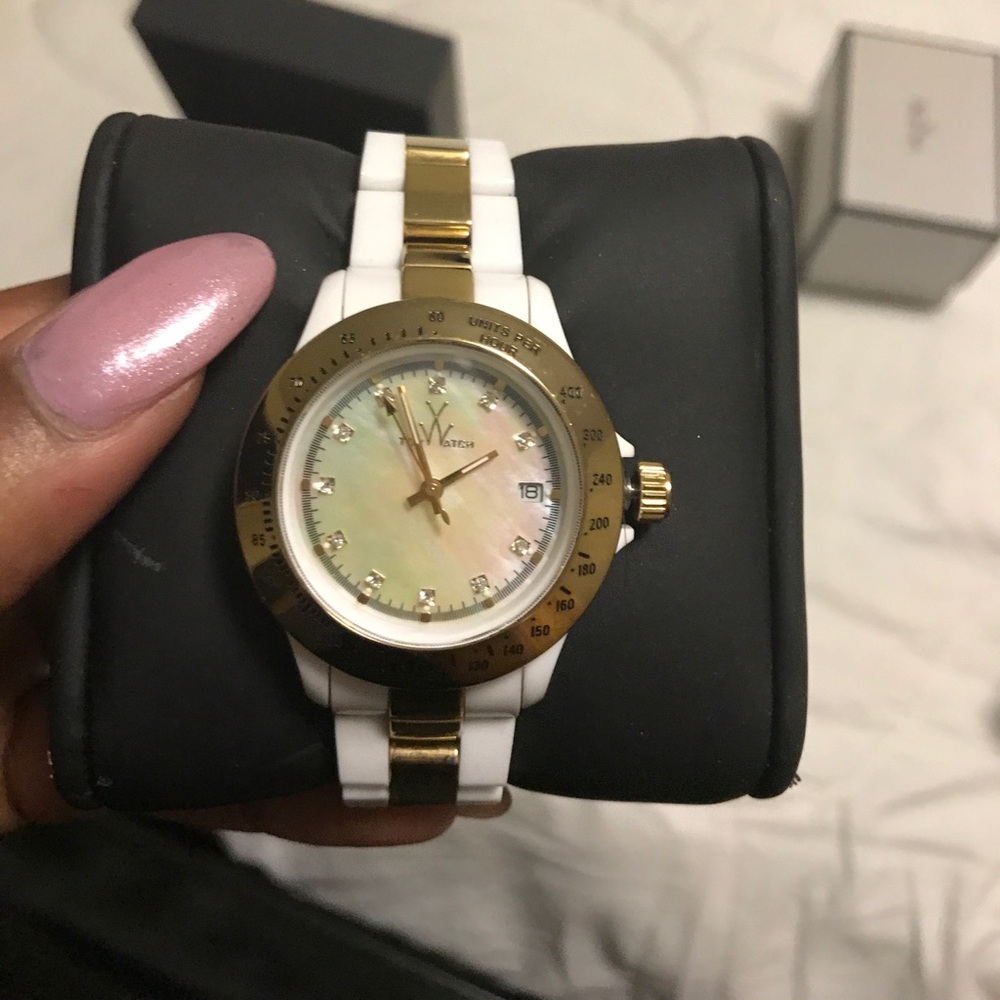 White and gold Toy watch w/pearl face