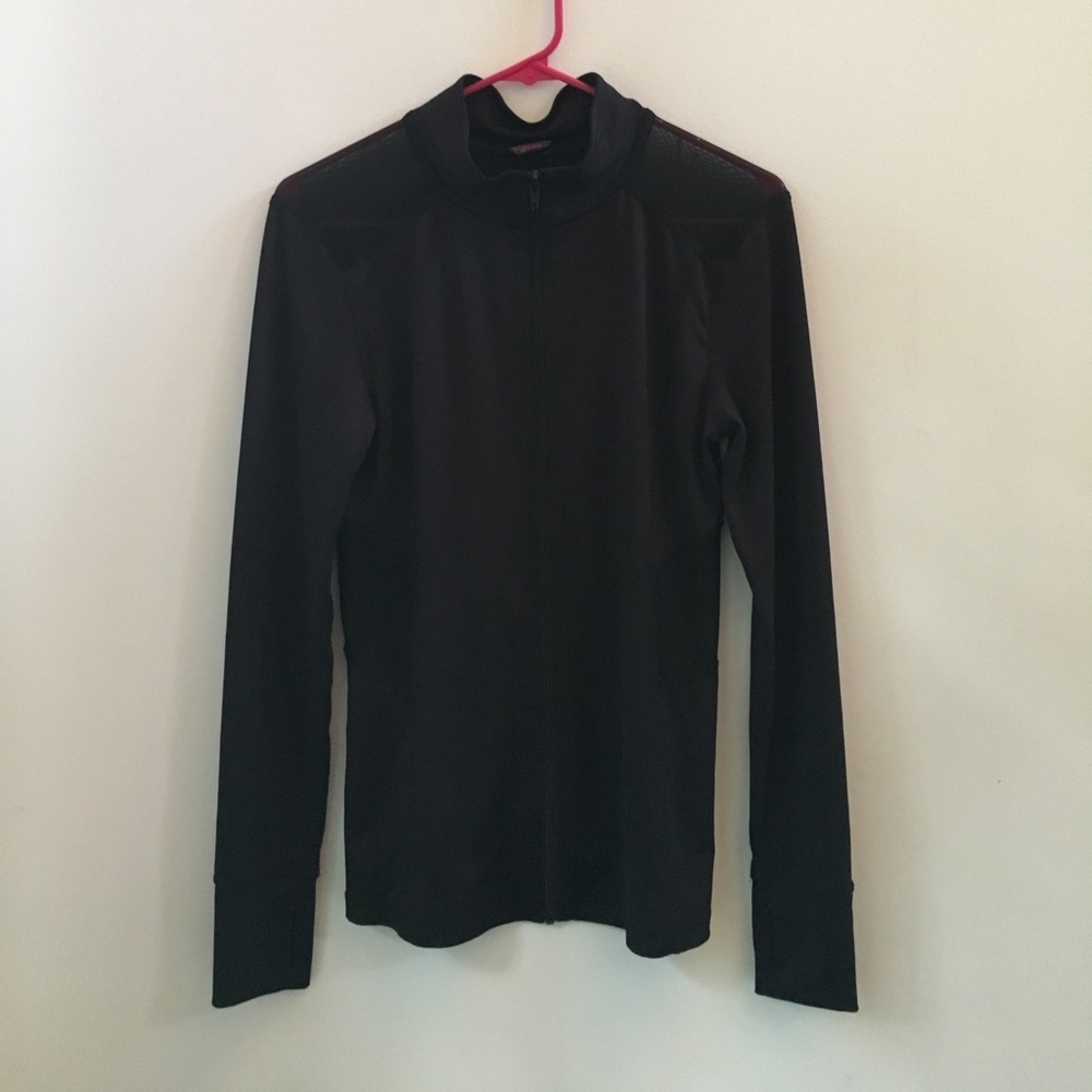 Black full zip with mesh cut outs.