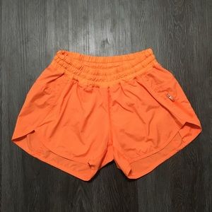 Lululemon orange tracker shorts