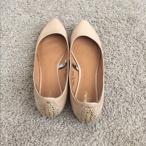 Nude Patent leather flats with spike heel detail