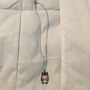 Black, pink, orange, yellow, and white owl neckace