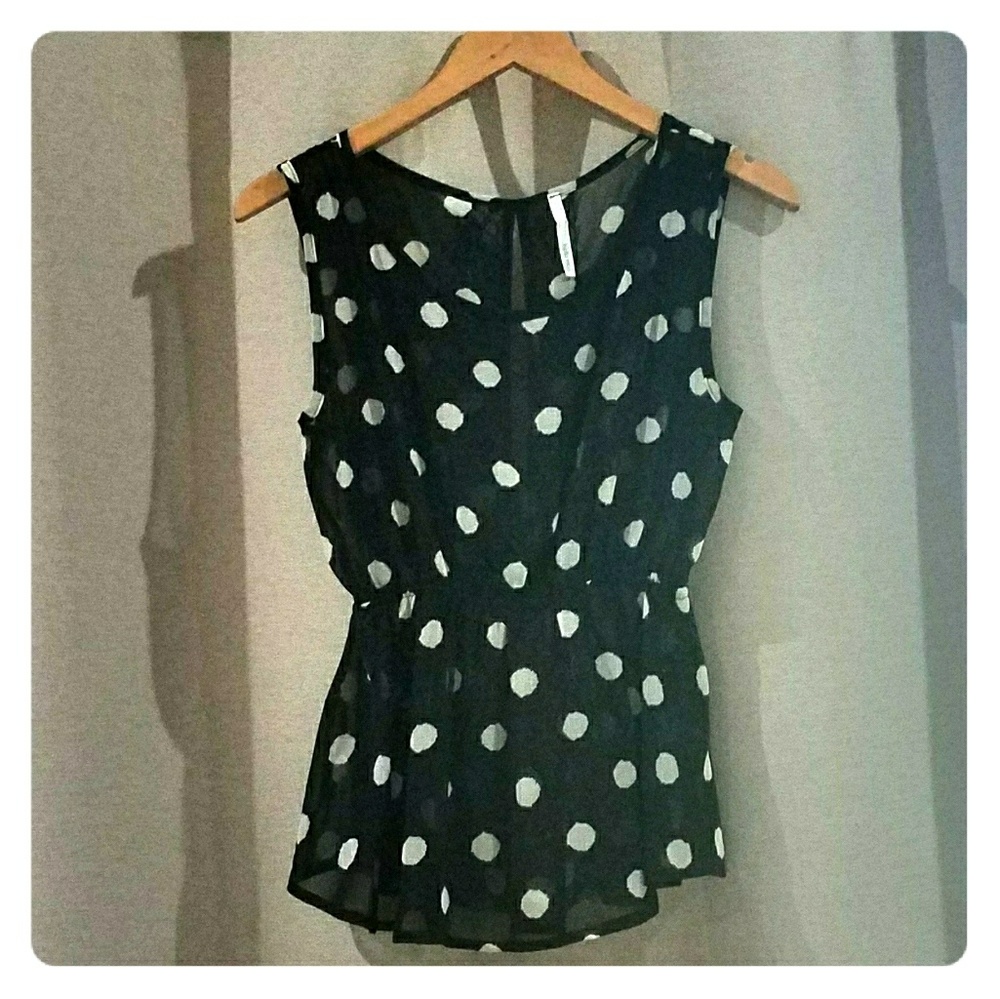 Sleeveless peplum polka dot top